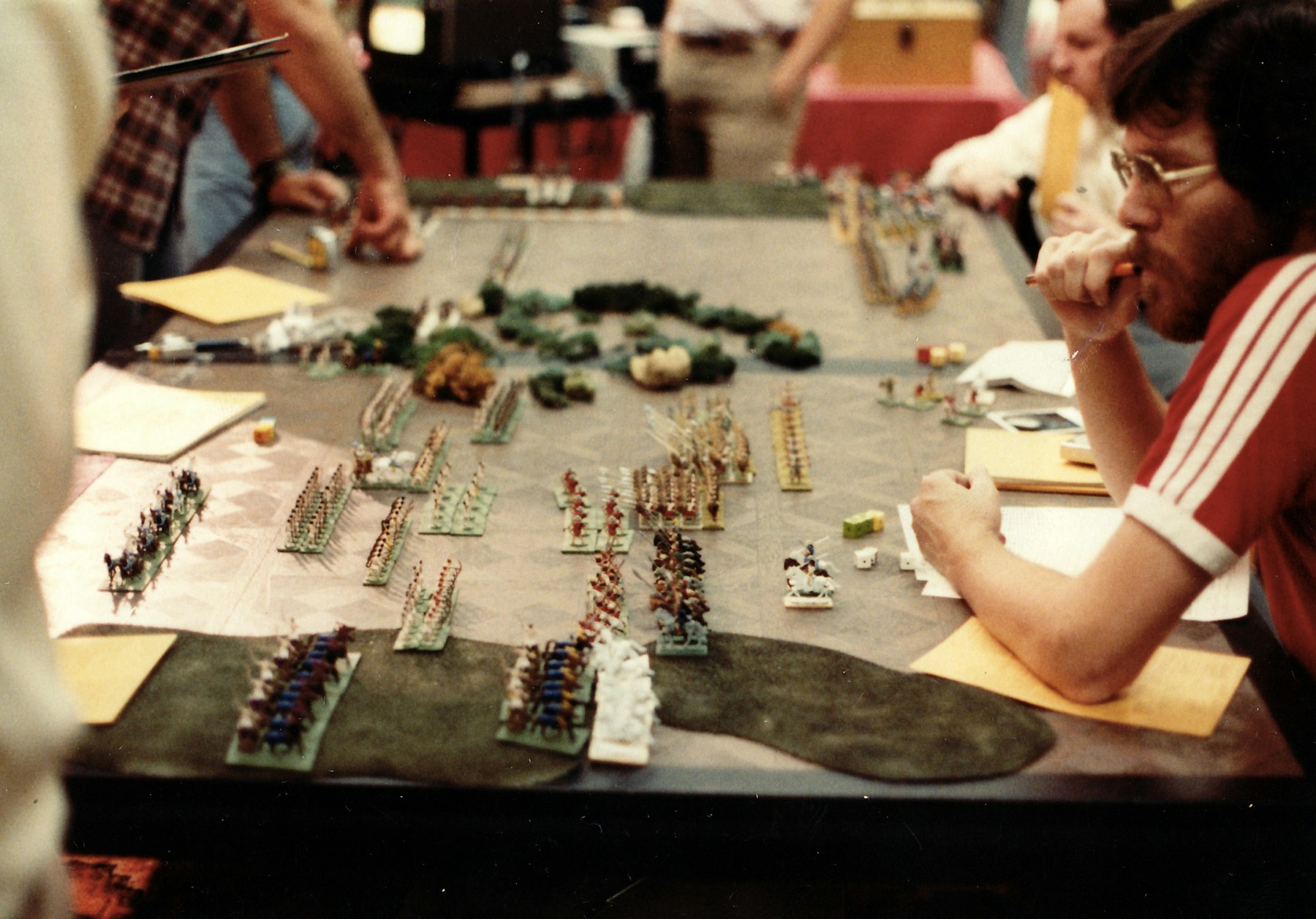 A group gathered around a table playing a game